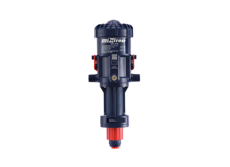 Mixtron MX075-VF water powered dosing pump showing compact design with control valve and inlet/outlet connections.